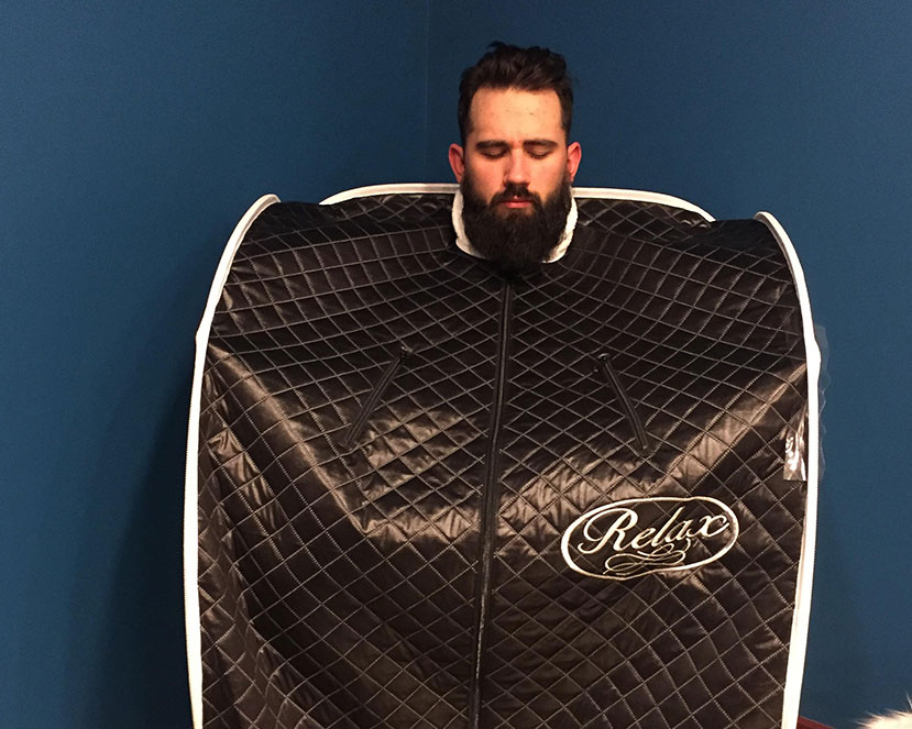 Man using Infrared Sauna at Living Well Balanced